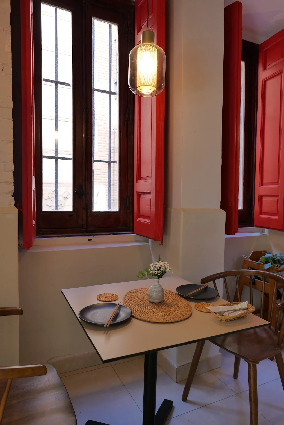 Table beside the red windows at B’My La Latina